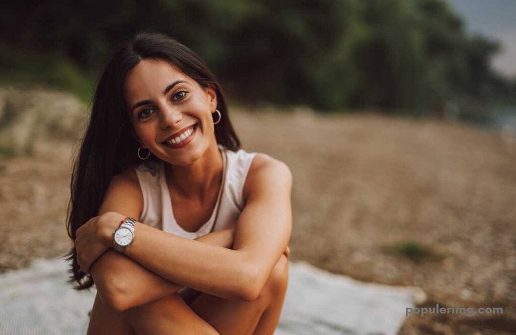 Happy Image Smiling Girl Wearing A White T-Shirt Sitting In A Place