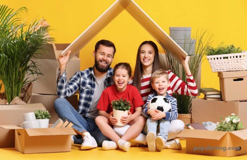 Sweet Happy  Family Sitting With Their Children Smiling 