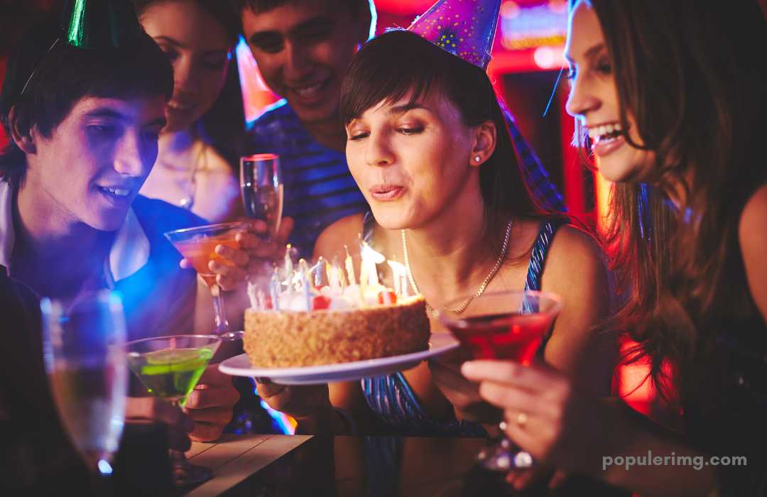 In The Image, The Girl Is Blowing Out The Candle On Her Cake And The Friend Is Wishing A Birthday.