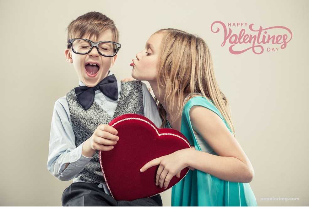 Two Kids Kissing On Valentine'S Day.	