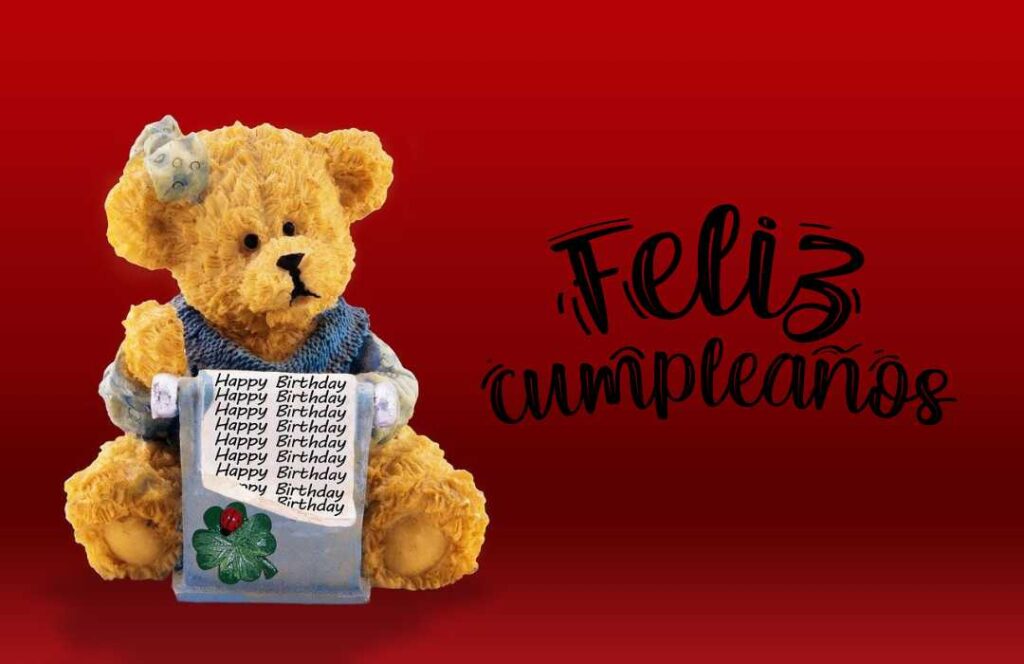 A Teddy Bear Holding A Card With The Words Feliz Acuerdos.	